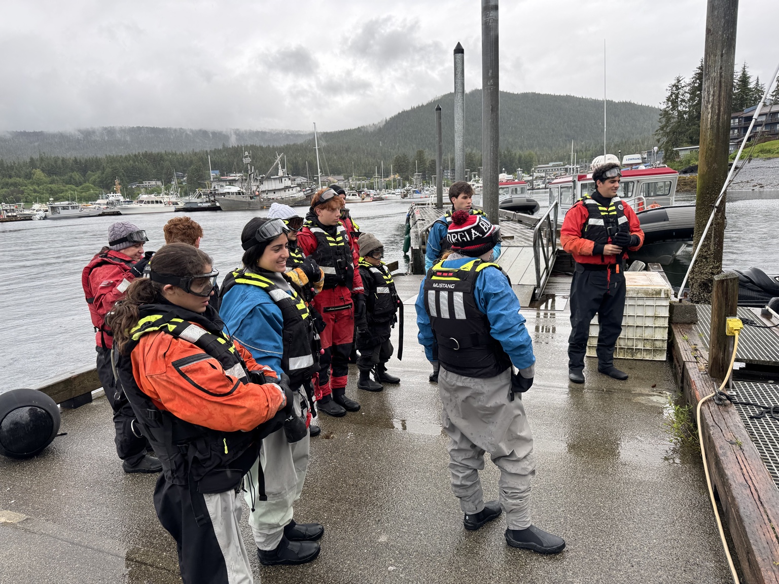 Guests receiving a dockside safety briefing in Auke Bay
